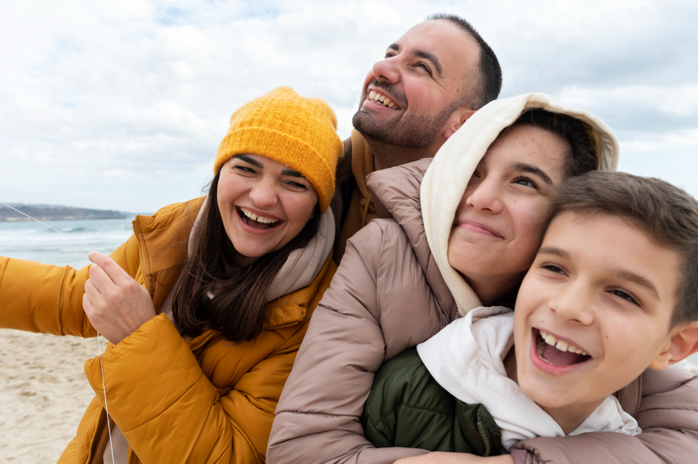Family laughing together on a beautiful holiday, making memories